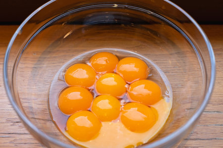 Many Egg Yolks in Glass Bowl Preparing Ingredients