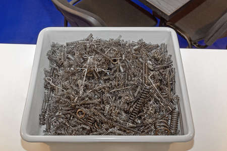 Many Metal Spring Coils Parts in Crate