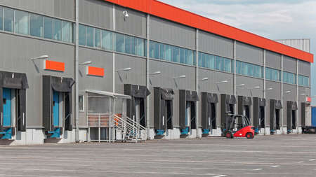 Cargo Dock Ramps for Loading Trucks at Long Distribution Warehouse