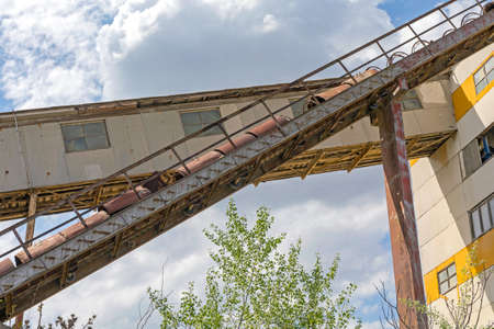 Long Conveyor Transport System at Abandoned Factory Buildingの写真素材