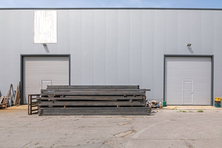 Metal Pipes and Tubes in Front of Warehouse Building