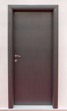 Closed Dark Black Wooden Door in Home Interiorの写真素材