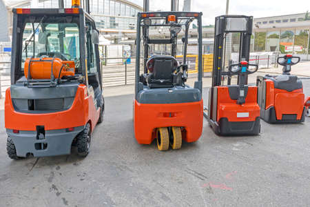 Four Forklift Trucks Gas and Electric Powered Vehicles