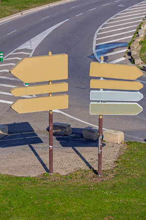 Two Traffic Sign Poles With Directional Arrows in Franceの写真素材