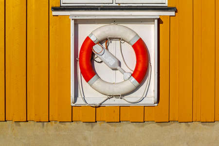 Lifebuoy Ring Safety Device at Wooden Cabin Wallの写真素材