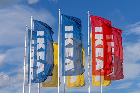 Belgrade, Serbia - August 06, 2021: Colourful Sweden Ikea Flags Flying at Sunny Day.のeditorial素材
