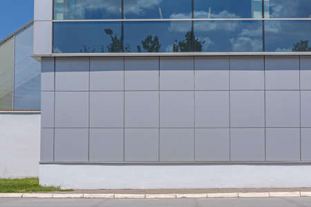 Grey Metal Wall at Industrial Building Exterior