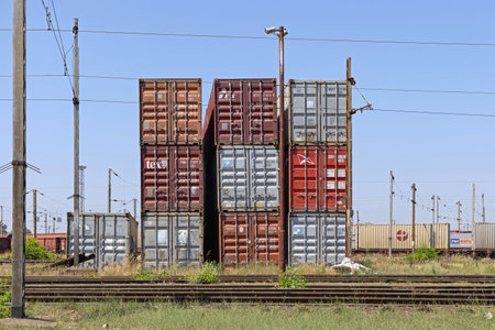 Belgrade, Serbia - August 09, 2021: Stacked Cargo Containers at Zeleznik Railway Yard.