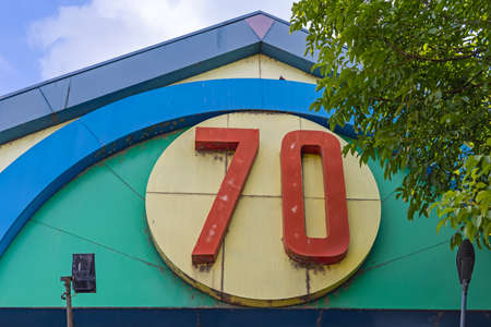 Big 3d Number Seventy at Colourful Building Exteriorの写真素材