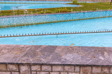Big Blue Fountain With Many Water Jet Nozzles Pipe