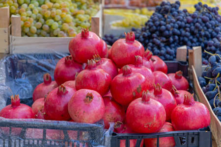 Red Pomegranate Fruits at Farmers Market Stallの写真素材