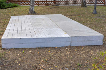 Empty Wooden Plank Boards Podium Stage in City Parkの写真素材