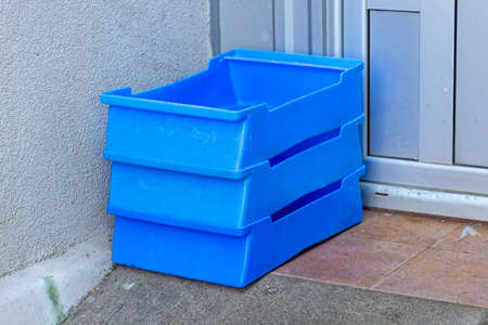 Stacked Milk Crates in Front of Shop Door Deliveryの写真素材