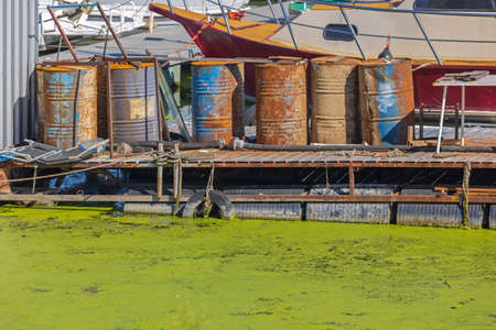 Rusty Oil Barrels at Green River Pontoon Pollutionの写真素材