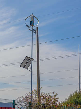 Vertical Axis Wind Turbine With Solar Panels Renewable Energy Generationの写真素材