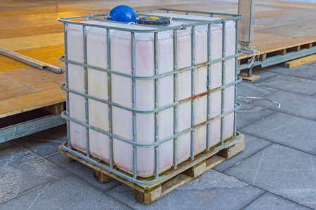 Portable Water Storage Tank Cage Pallet at Construction Siteの写真素材