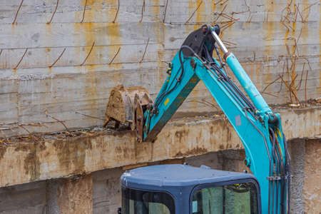 Small Digger Machine in Underground Basement Concrete Construction Site