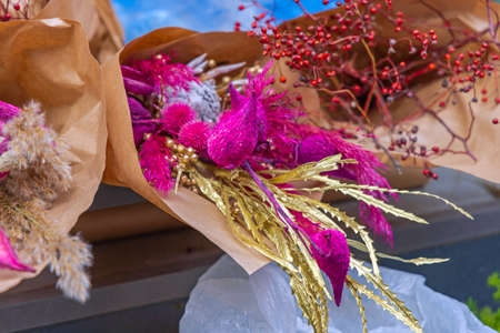 Bouquet of Dry Purple Flowers With Gold Leaves Christmas Decorの写真素材