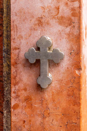 Silver Metal Cross at Marble Wall Orthodox Christian Church