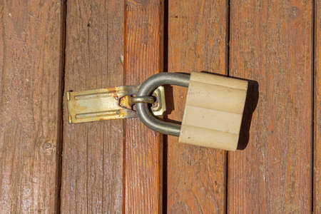 Big Padlock Security at Wooden Door Shed