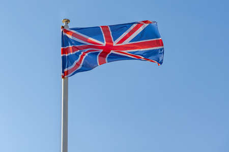 Union Jack Flag of United Kingdom Blue Skyの写真素材