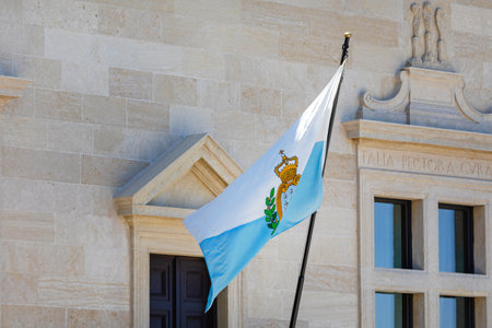 San Marino - June 16, 2019: White and Blue National Flag Republic of San Marino at Buildingのeditorial素材