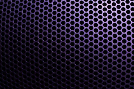Steel grid with round holes and violet gradientの写真素材