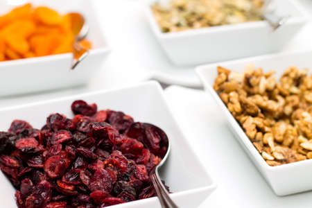 Dried fruit in white ceramics bowls