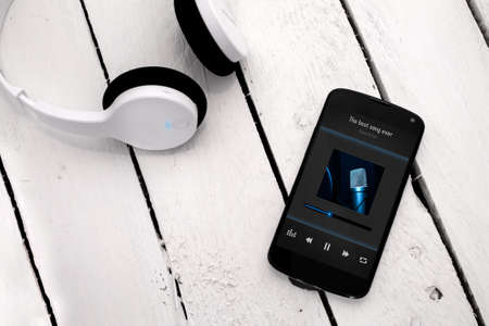 Concept of listening music from smartphone with wireless technology.