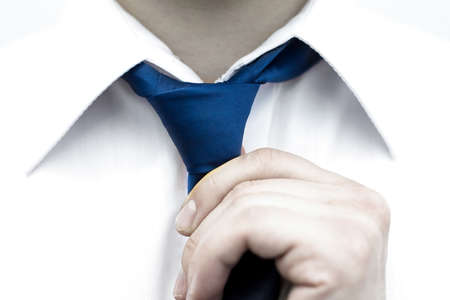 Businessman in white shirt tying the necktieの写真素材