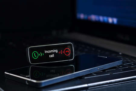 Smartwatch with "incoming call" notification on the display. Interface on watch screen was generated in graphical programの写真素材