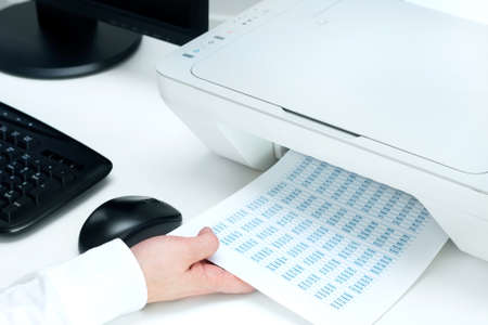 Man takes out some documents from printer