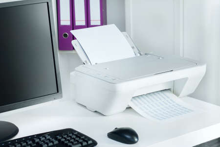 Composition of white printer and black computer in modern officeの写真素材