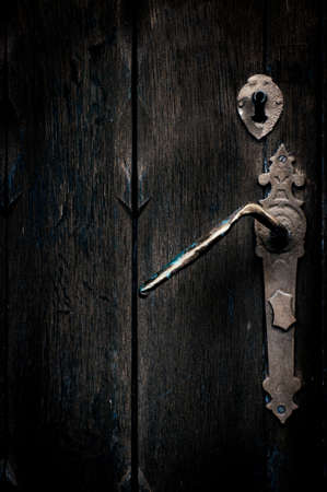 Mystical old door with handle and lockの写真素材