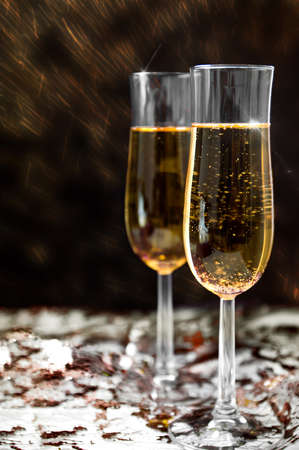 Two champagne glasses on the fireworks backgroundの写真素材
