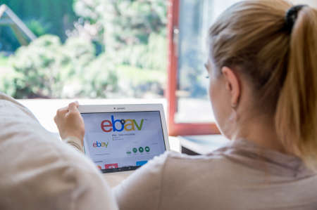 WROCLAW, POLAND- APRIL 10th, 2017:  Woman is installing ebay application on Lenovo tablet. eBay is a multinational e-commerce corporation, facilitating online C2C and B2B sales.のeditorial素材