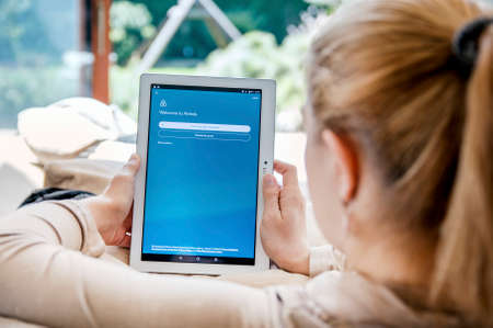 WROCLAW, POLAND- APRIL 10th, 2017:  Woman launches Airbnb application on Lenovo tablet. Airbnb is an online marketplace and hospitality service, enabling people to lease or rent short-term lodgingのeditorial素材