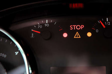 Warning triangle light and "stop" ignite on dashboardの写真素材