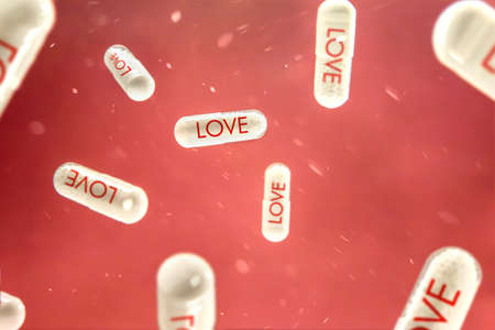 Pills with "love" sign hangs on the red background. Conception of new discovery in medicine.の写真素材