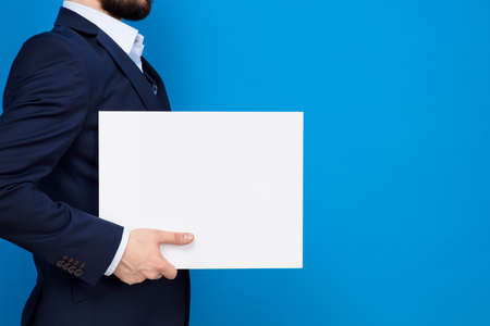 Businessman with white board with copy space for your text.の写真素材