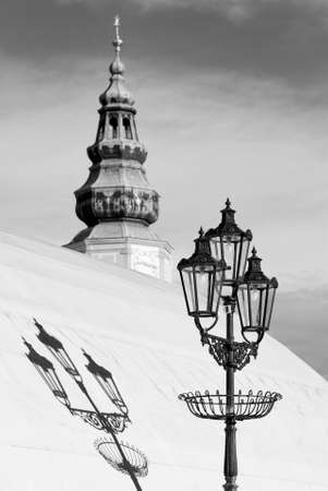 Tower of the chateau in Kromeriz, Czech Republic composed together with a historic street lamp.の写真素材