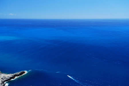 Looking at the Mediterranean Sea from a high cliff.