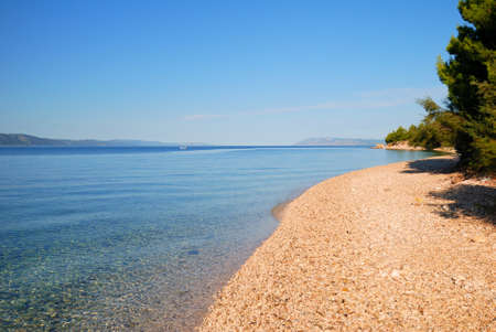 Calm Blue Sea and empty beach in Croatiaの写真素材