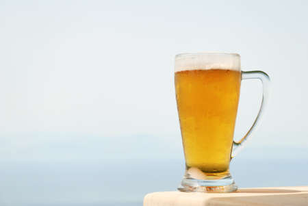 Glass mug of cold beerの写真素材