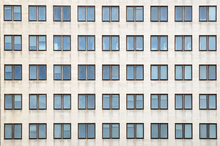 Multiple closed windows on a large office buildingの写真素材