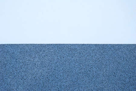 Wall plaster texture in two different tones of blue color and patternの写真素材