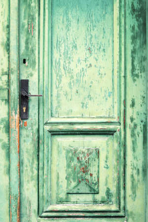 Old and weathered green door textureの写真素材