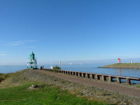 Green and red lighthouseの写真素材
