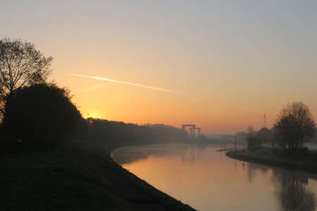 Mist over the river at sunriseの写真素材