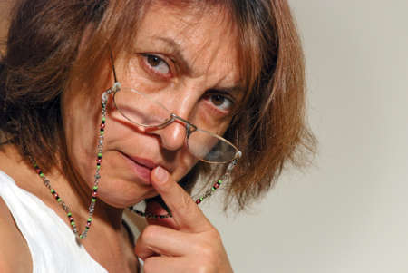 Portrait of sad  pensive elderly woman